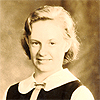 Marie Young with tennis racquet and trophy